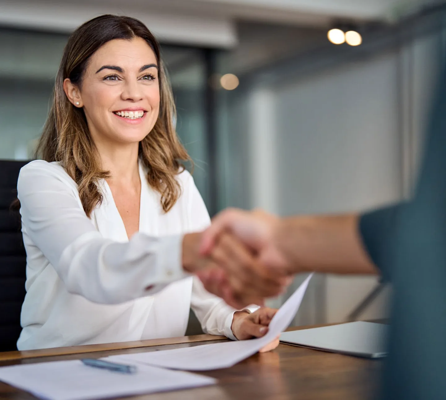 Property manager shaking hands with an owner