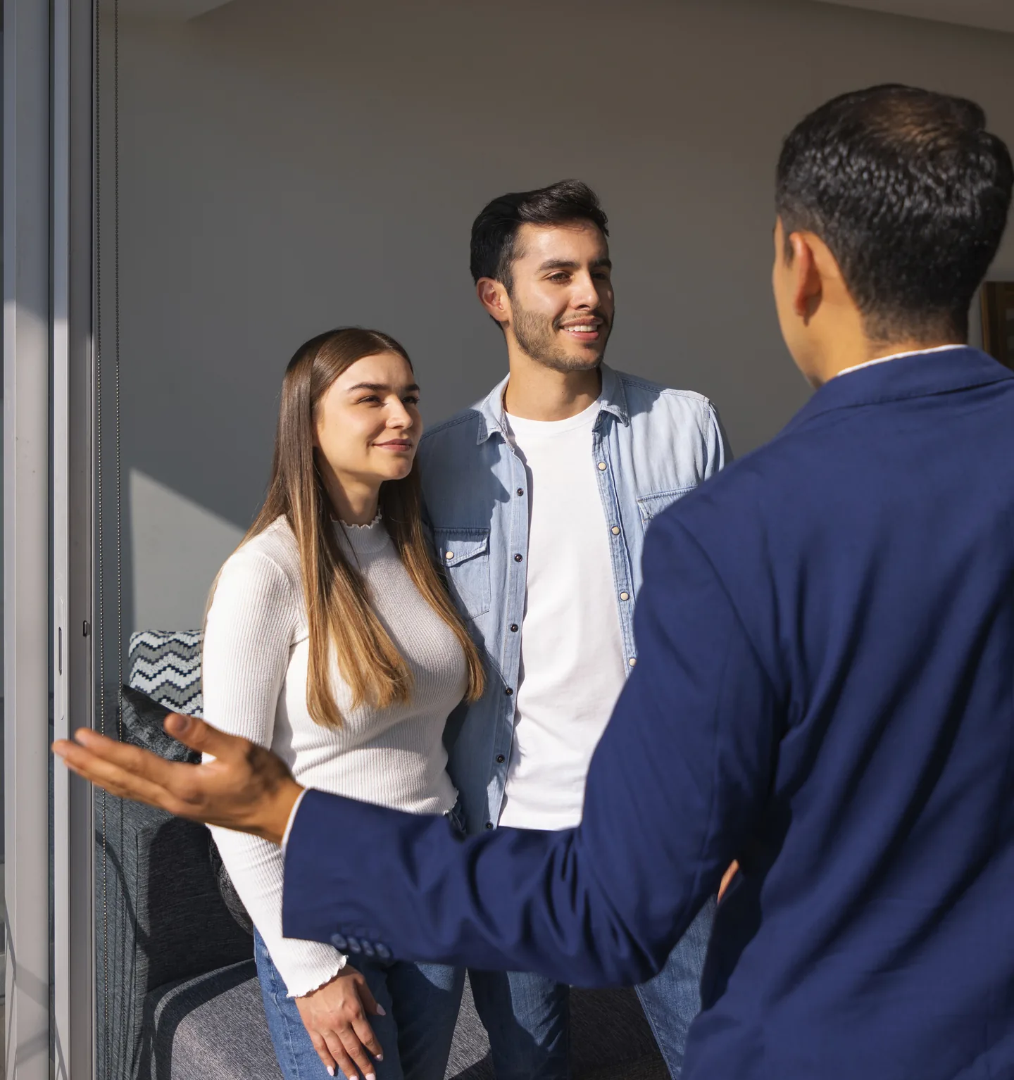 Real estate agent showing a rental to a young couple